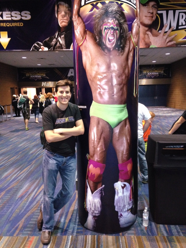 Posing with an oversized version of the Ultimate Warrior at WrestleMania Axxess.